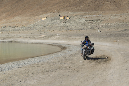 Ladakh,India - July 10,2014 : Biker riding at Pangong Lake.のeditorial素材