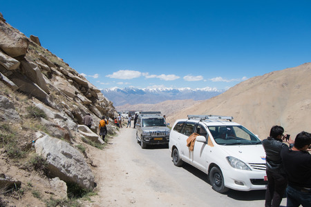 Leh Ladakh,India - July 9,2014 : Traveller waiting for road workers fixing damaged road to Pangong Lake.のeditorial素材