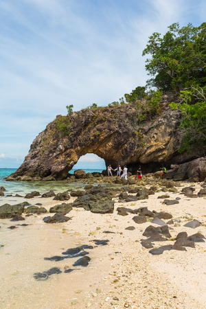 Satun,Thailand - November 28,2014 : Tourists visiting stone arch with beautiful beach at Koh Khai in Andaman Sea,Tarutao national park and Koh Lipe,Thailandのeditorial素材
