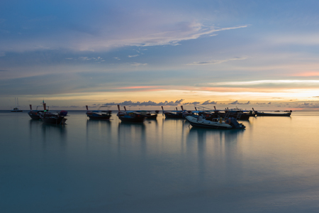 Silhouette sunset sky at pattaya beach in Koh Lipe Island.Soft focus and motion blur due to long exposure shotの写真素材