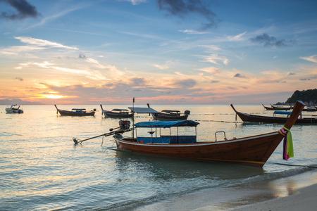 Long tail boats with sunrise sky in Koh Lipe Islandの写真素材