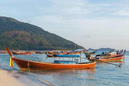 Long tail boats with sunrise sky in Koh Lipe Islandの写真素材