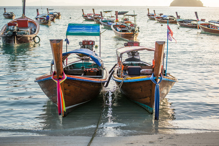 Long tail boats with sunrise sky in Koh Lipe Islandの写真素材