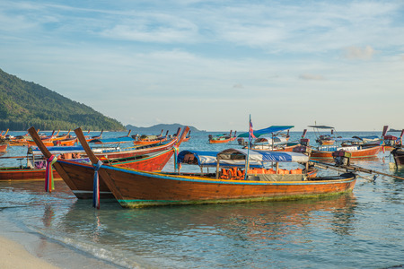 Long tail boats with sunrise sky in Koh Lipe Islandの写真素材