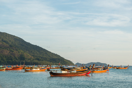 Long tail boats with sunrise sky in Koh Lipe Islandの写真素材
