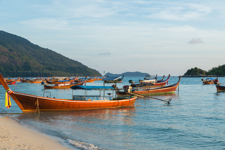 Long tail boats with sunrise sky in Koh Lipe Islandの写真素材