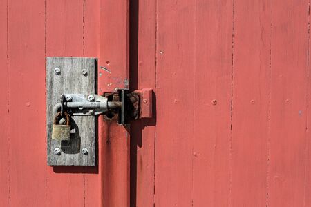 Old door red wooden rustic locker structure wall block designの写真素材
