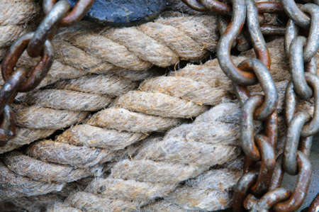 A texture of a thick old rope with steel chains