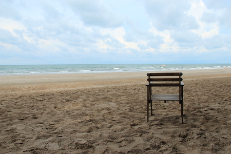 A chair on empty wide and long beachの写真素材