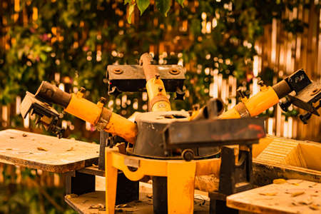 A vertical closeup shot of a working saw in the gardenの写真素材