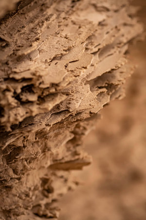 Closeup of sandstone, abstract pattern of yellow ochre sand/