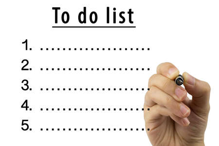 Woman hand writing To do list with black pen