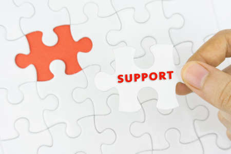 Business concept. Missing jigsaw puzzle piece with SUPPORT word.の写真素材