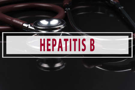 Stethoscope on black background with text HEPATITIS Bの写真素材
