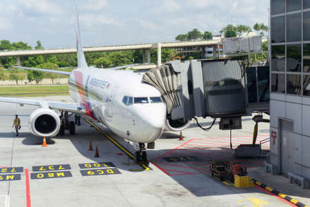 KUALA LUMPUR, FEB 23: Airplane Boeing 737-800 of Malaysia Airlines is ready for boarding passengers, as ground crew prepares the plane for the next flight, February 23, 2017 in Kuala Lumpur International Airport, Malaysia.のeditorial素材