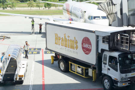 KUALA LUMPUR, FEB 23: Airplane Boeing 737-800 of Malaysia Airlines is ready for boarding passengers, as ground crew prepares the plane for the next flight, February 23, 2017 in Kuala Lumpur International Airport, Malaysia.のeditorial素材