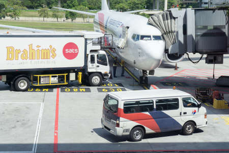 KUALA LUMPUR, FEB 23: Airplane Boeing 737-800 of Malaysia Airlines is ready for boarding passengers, as ground crew prepares the plane for the next flight, February 23, 2017 in Kuala Lumpur International Airport, Malaysia.のeditorial素材