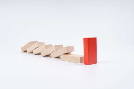 Leadership concept using wooden domino over white background.の写真素材