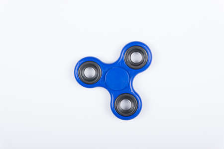 Fidget spinner stress relieving toy isolated on white background.の写真素材