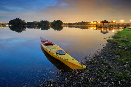 Amazing sunset reflections on the lake at Putrajaya Wetland, Malaysia. Slightly noise and soft focus due to long exposure.の写真素材