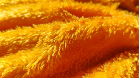 Bright yellow velvet fabric with an ultra plush texture, perfect for home decor and blankets