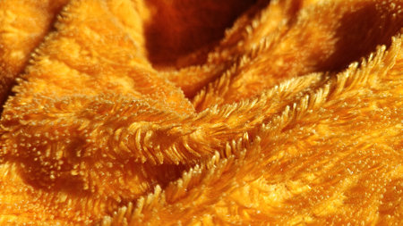 Ultra soft yellow velvet fabric, perfect for creating warm and cozy blankets or towels