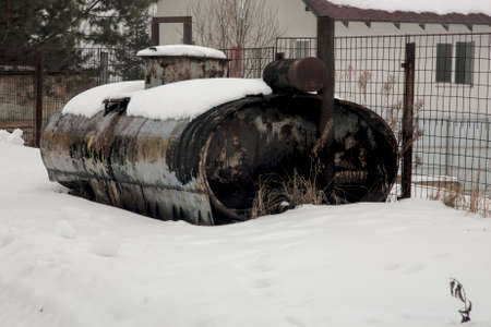 Old tank in the snowの写真素材