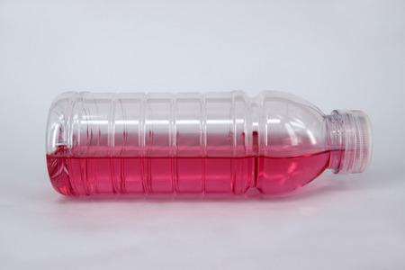 Transparent bottle with red color drinkの写真素材