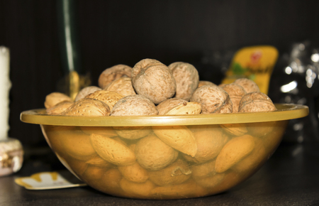 Walnuts and almonds in the shellの写真素材