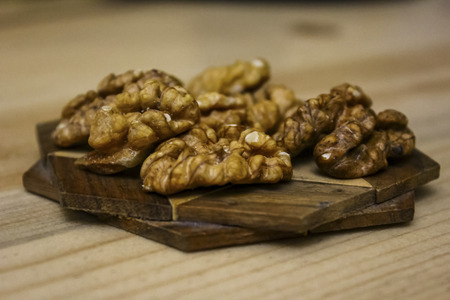 shelled walnuts on a wooden standの写真素材