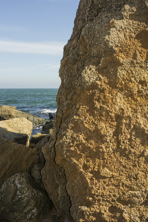 yellow stone from rakushnyaka standing near the seaの写真素材