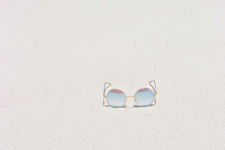 Sunglasses get along well with sea and beach at Tachai Island of Southern Thailandの写真素材