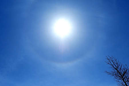 Sun and the blue sky with white clouds. Abstract nature background.の写真素材