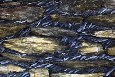 Background texture in gray, blue and black colors scale, made of natural rocks