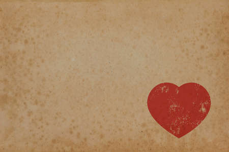 Red heart on vintage paper with copyspace. Old paper texture. の写真素材