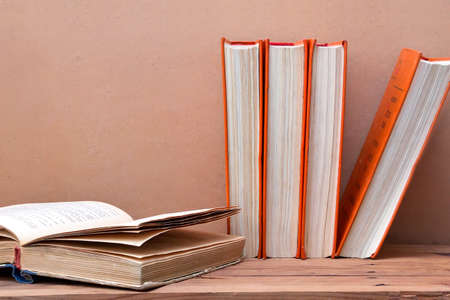 Stack of books. Old books stacked  with one open book. 