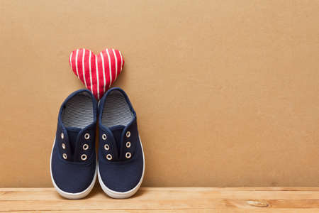 Shoes and heart on top. Love theme. Love of shoesの写真素材