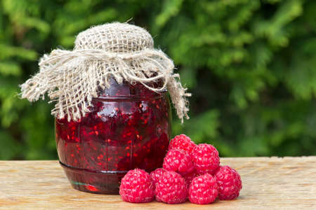 Glass jar of raspberry jam. Delicious homemade jamの写真素材