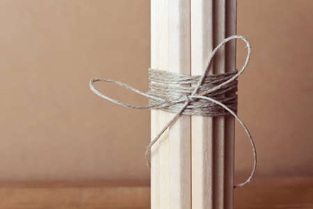 Rope bow. Pencils tied with rope