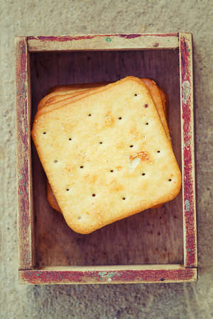 Square crackers in vintage box.の写真素材