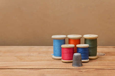 Spools of thread and thimble  Tools for sewing and handmade