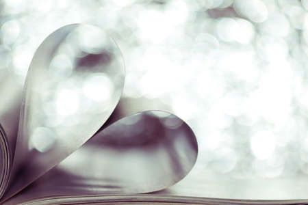 Book with pages folded into a heart shape