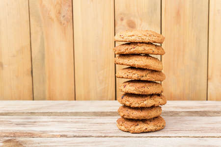 Stack of oatmeal cookies. Oatmeal cookies on wooden tableの写真素材