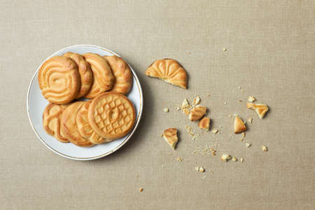 Biscuits on a plate and crumbsの写真素材