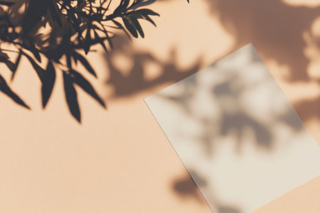 Abstract Minimalist Mockup with Leaf Shadows on Blank Paper Background for Design Projectsの素材