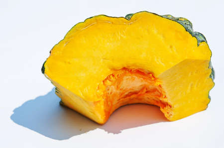 Slice of fresh pumpkin isolated on white backgroundの写真素材