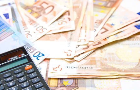 calculator with money backgroundの写真素材