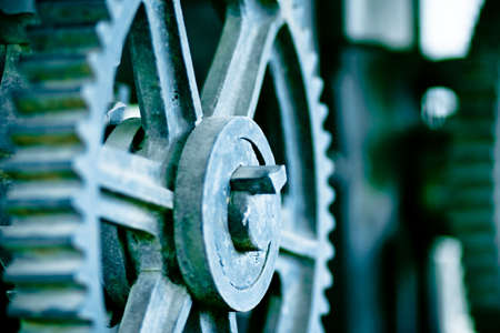 large old industrial gears set in blue metallic toningの写真素材