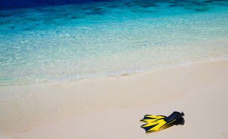 snorekl equipment on white sand beach at Maldivesの写真素材