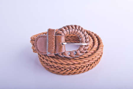 Brown belt on white background の写真素材